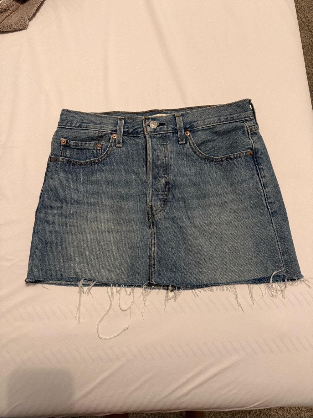 Classic Light Blue Denim Mini Skirt with Frayed Hem